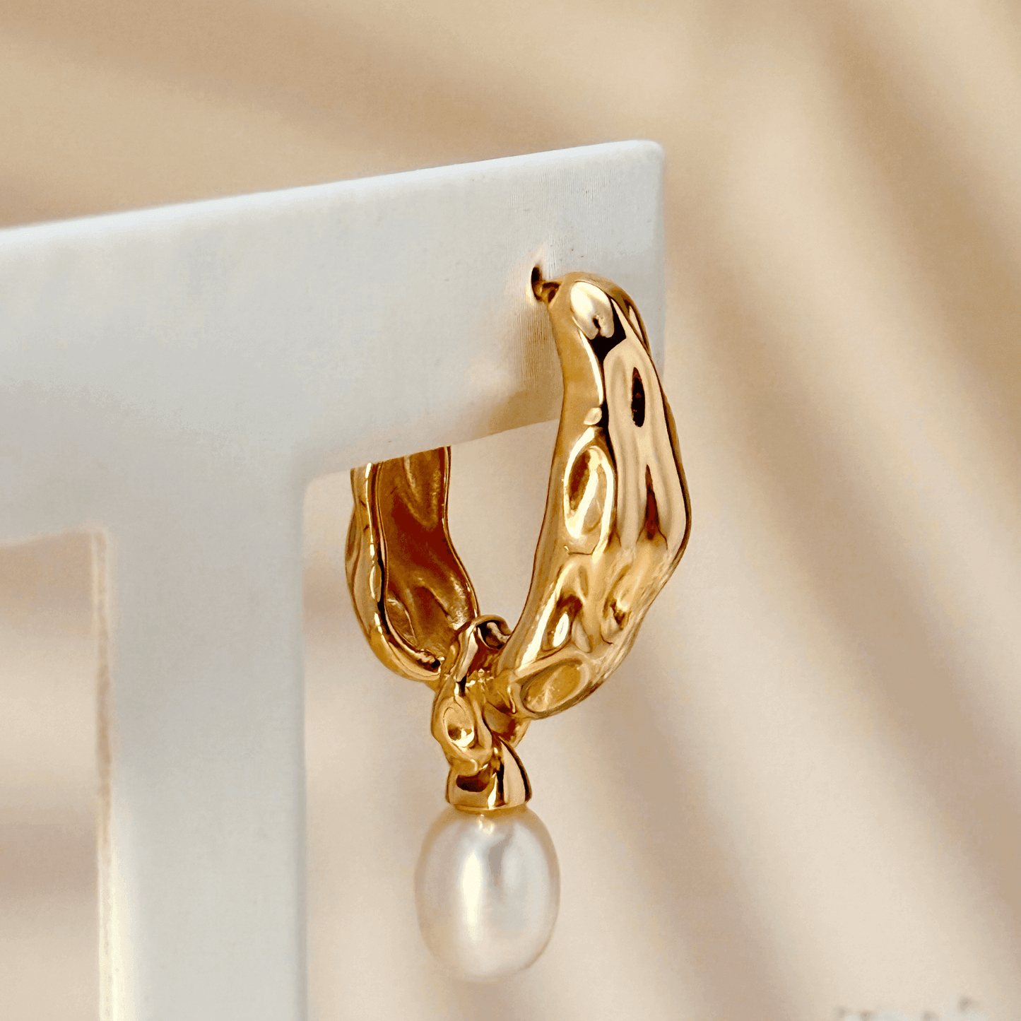 Elegant gold-plated freshwater pearl drop earrings with vintage molten texture, crafted in 925 sterling silver for a timeless, sophisticated look.