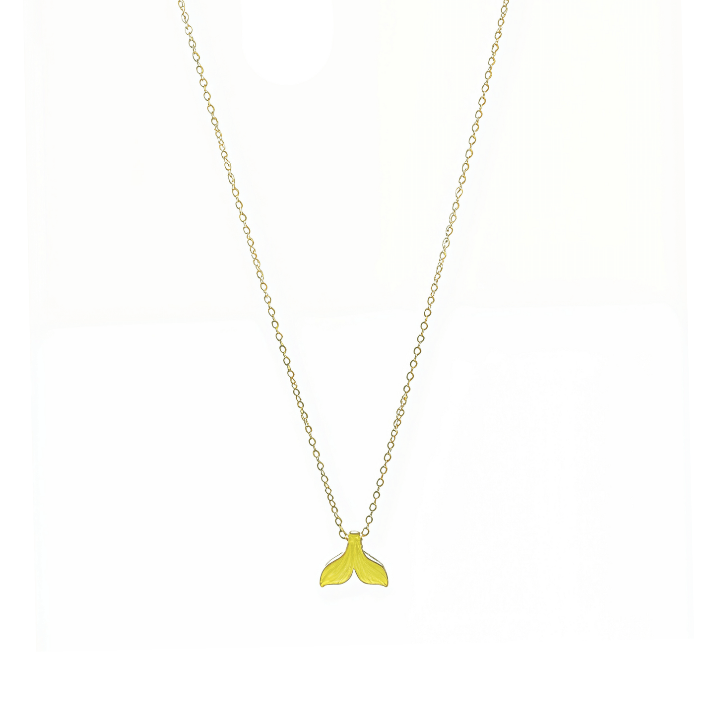 Gold necklace with a gold mermaid tail pendant on a white background