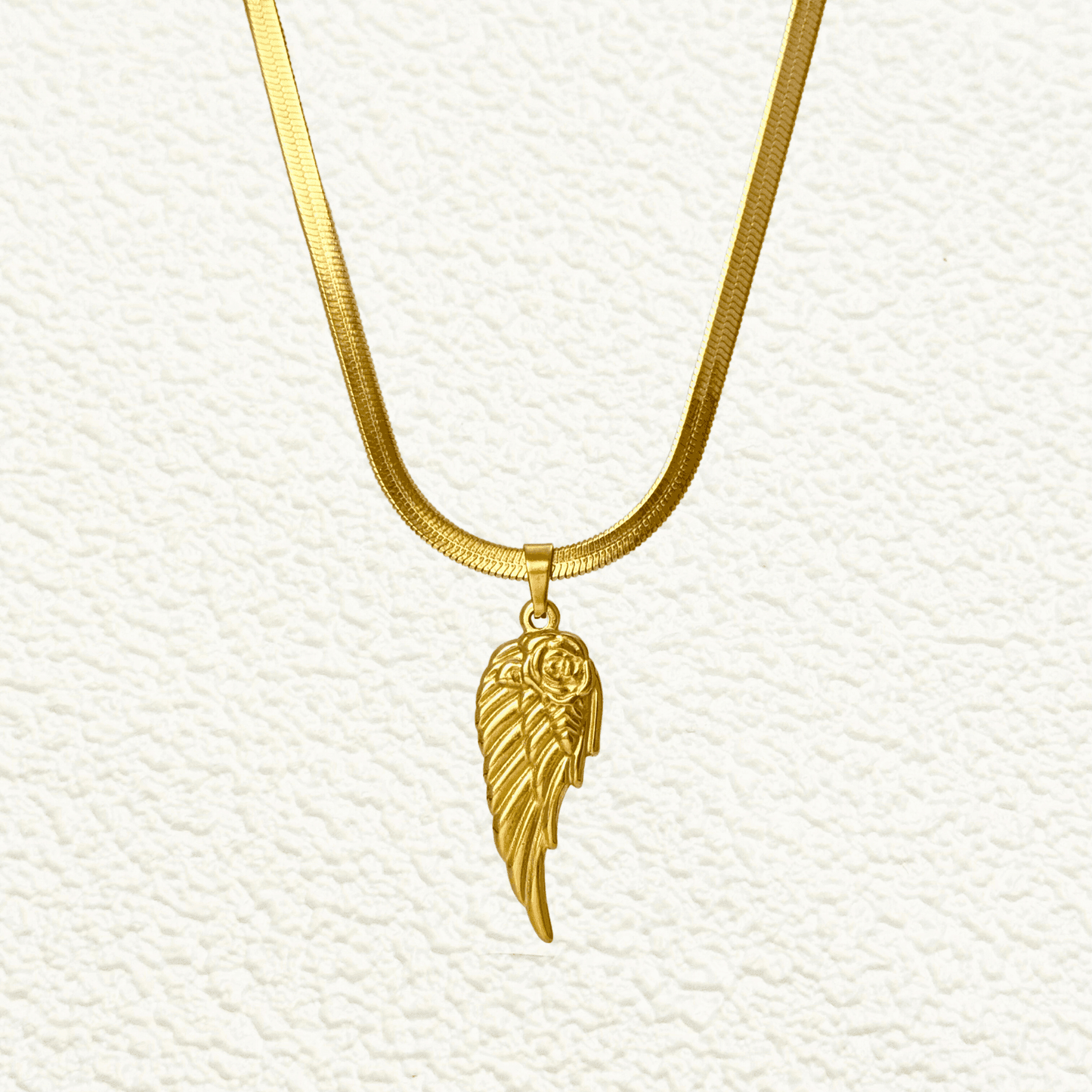 gold angel wing pendant necklace with rose detail, stainless steel jewellery with herringbone chain, dainty meaningful gold necklace for women, tarnish-resistant gift from MXW Jewellery Australia