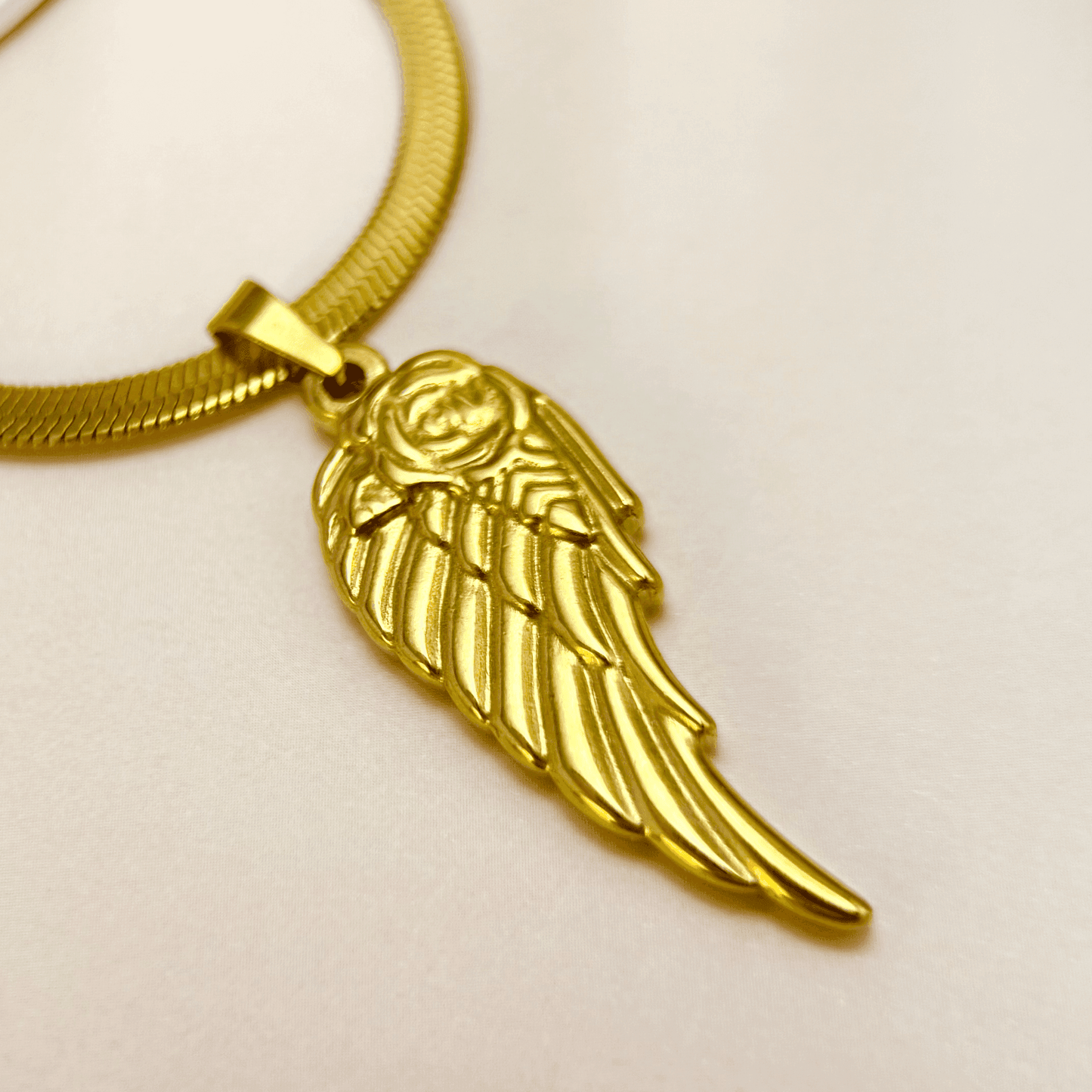 gold angel wing pendant necklace with rose detail, stainless steel jewellery with herringbone chain, dainty meaningful gold necklace for women, tarnish-resistant gift from MXW Jewellery Australia