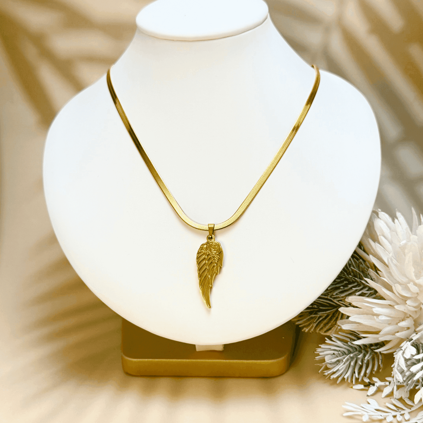 gold angel wing pendant necklace with rose detail, stainless steel jewellery with herringbone chain, dainty meaningful gold necklace for women, tarnish-resistant gift from MXW Jewellery Australia