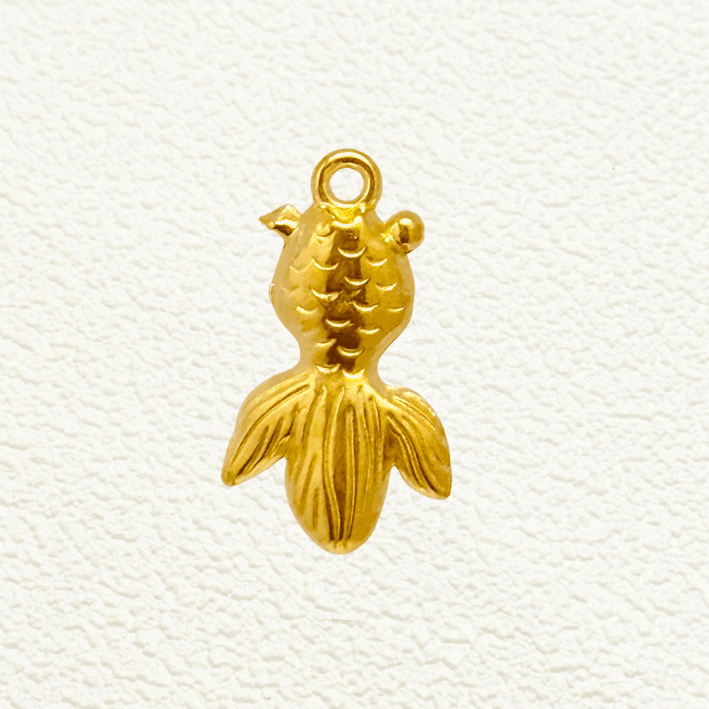 Gold goldfish charm with textured scales and a wide flowing tail