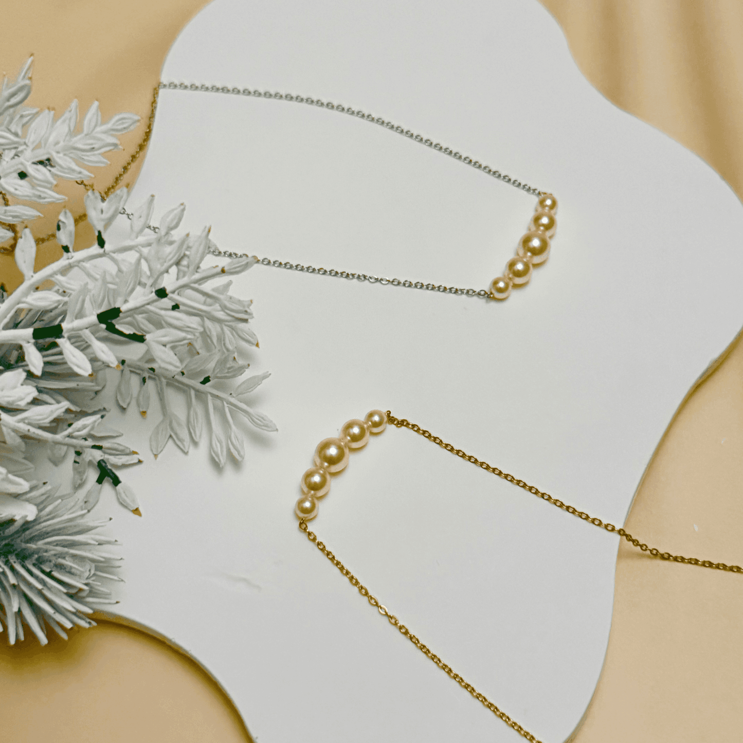 Graduated Swarovski crystal pearl necklace on gold or silver stainless steel chain – modern minimalist jewelry from MXW Jewellery
