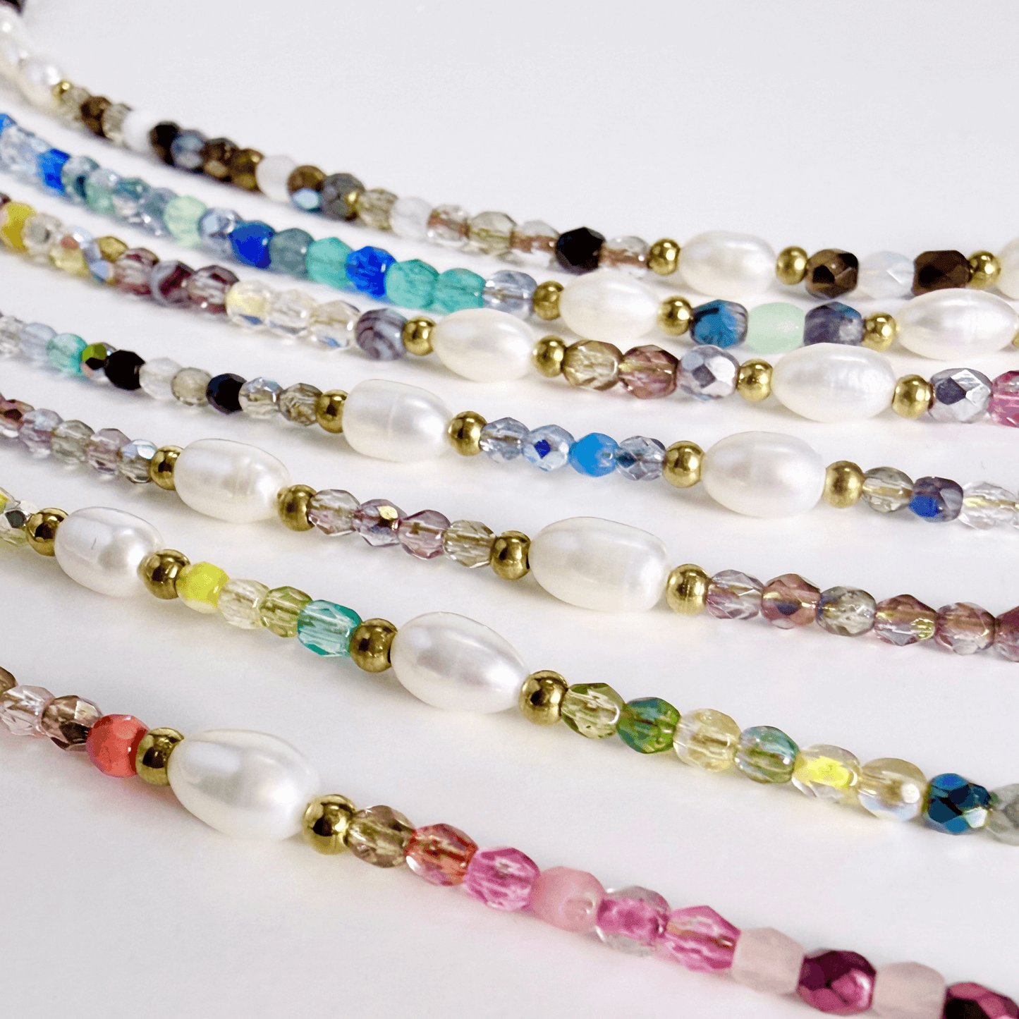 Handmade necklace with Czech glass beads and freshwater pearls, finished with gold or silver findings.