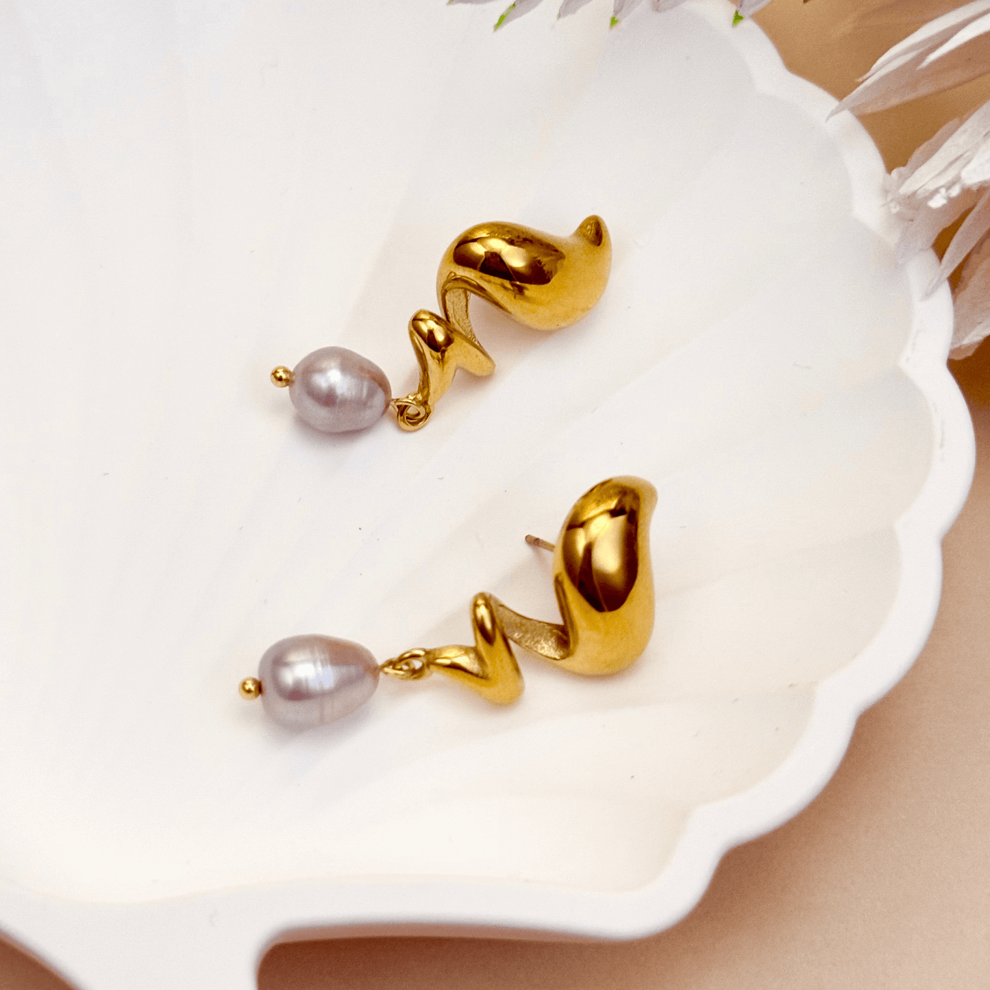 Gold sculptural twist earrings with grey freshwater pearls, modern waterproof PVD gold pearl drop earrings