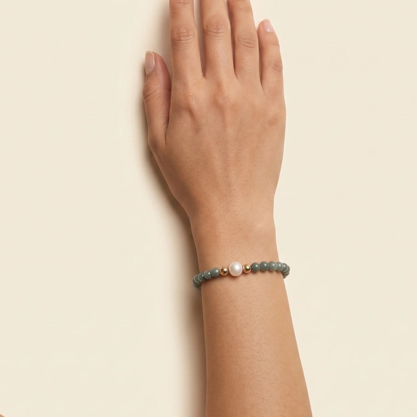 Guatemalan jade, pearl and initial gold bracelet featuring premium blue green Guatemalan jade beads, lustrous pearls and a personalised gold-filled stamped initial disc.