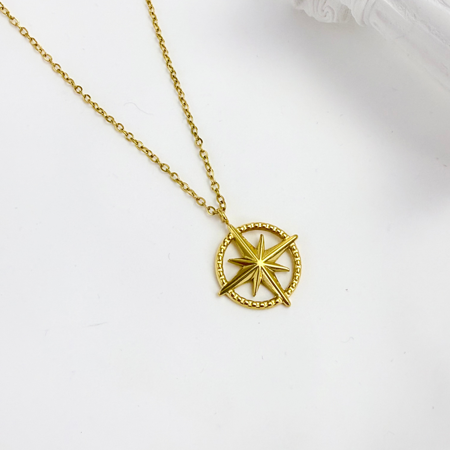 Gold compass necklace symbolising guidance and meaning – MXW Jewellery