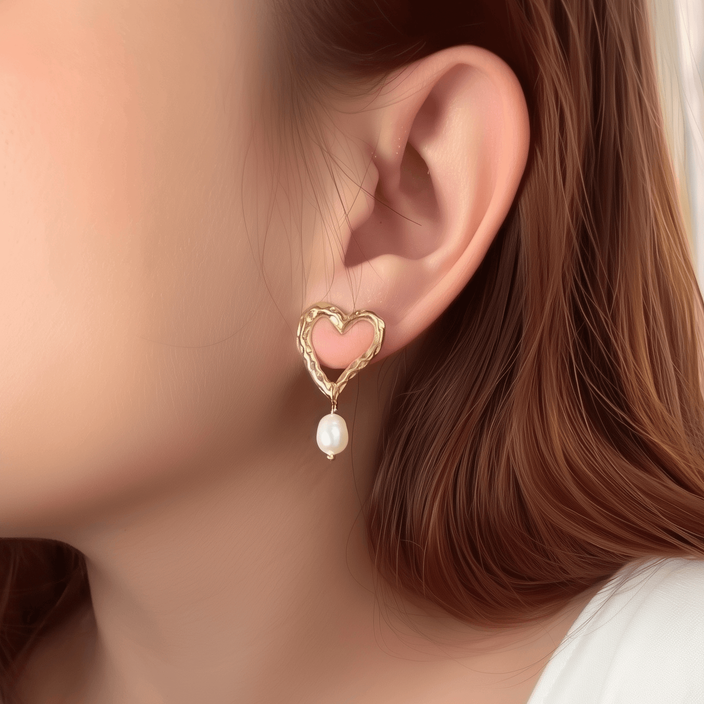 Gold hammered open-heart earrings with natural freshwater pearl drops, made from PVD gold plated stainless steel