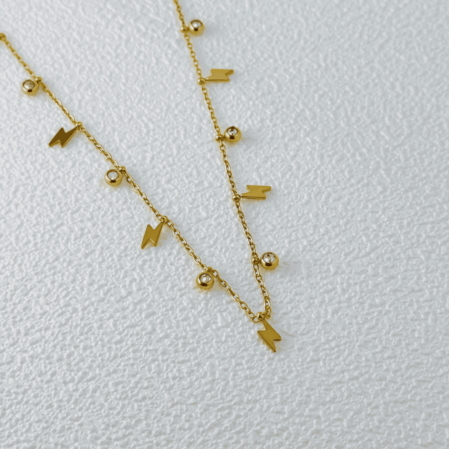 Lightning Bolt & Zircon Gold Necklace – waterproof gold-plated stainless steel with zircon stones and lightning bolt charms