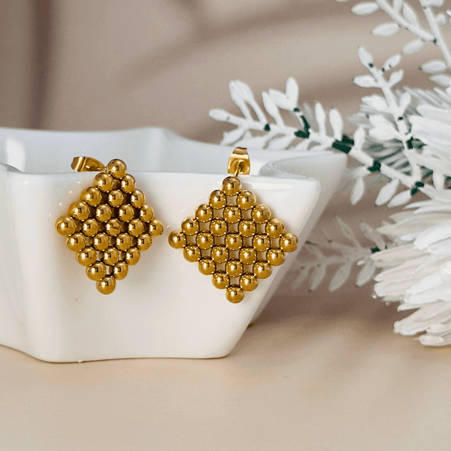 Lyra geometric gold mesh statement earrings, bold and structured gold-tone jewellery for a modern, stylish look.