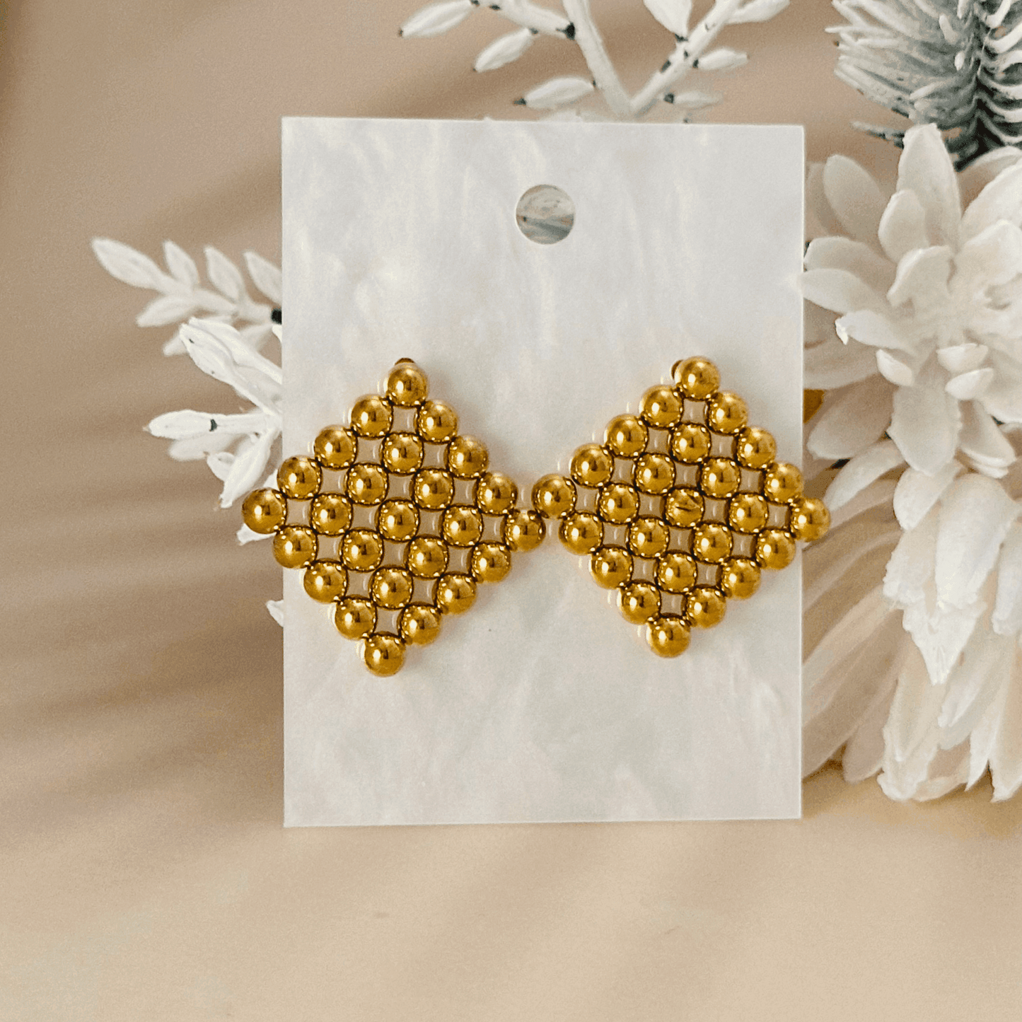 Lyra geometric gold mesh statement earrings, bold and structured gold-tone jewellery for a modern, stylish look.