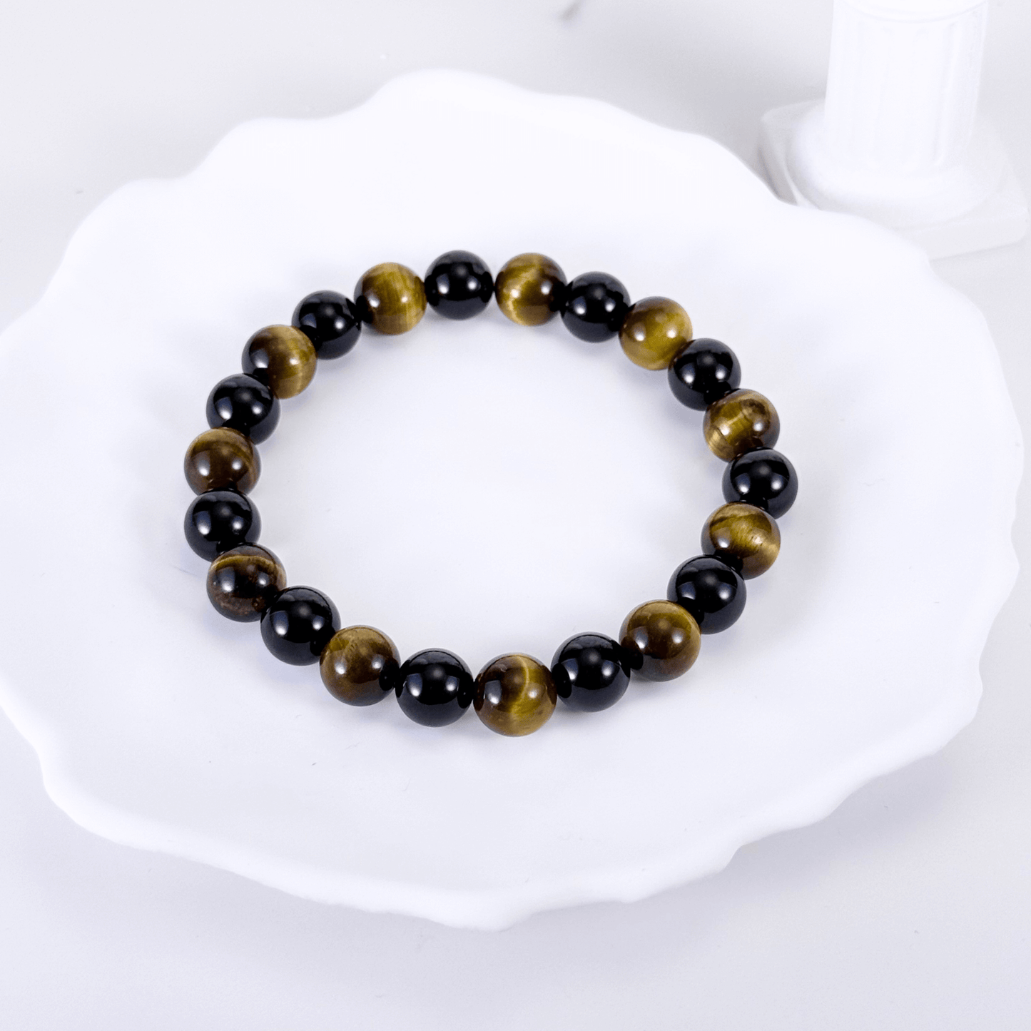 Handmade men’s bracelet with round black agate and tiger’s eye gemstone beads on elastic cord.