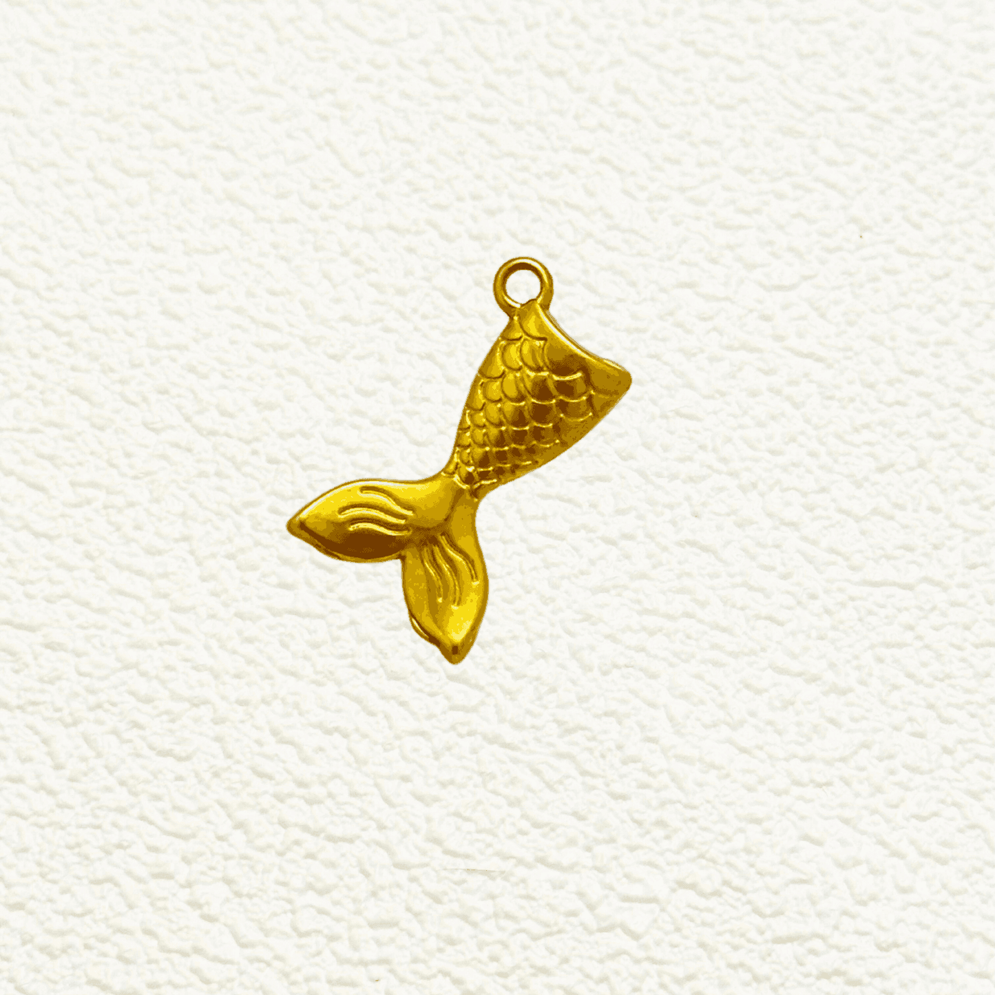 Gold Mermaid Tail Charm with scale detail and curved fluke design