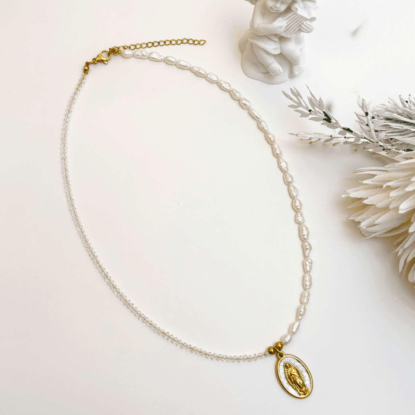 Our Lady charm necklace handcrafted with keshi pearls and Swarovski crystals – elegant, meaningful, and waterproof.