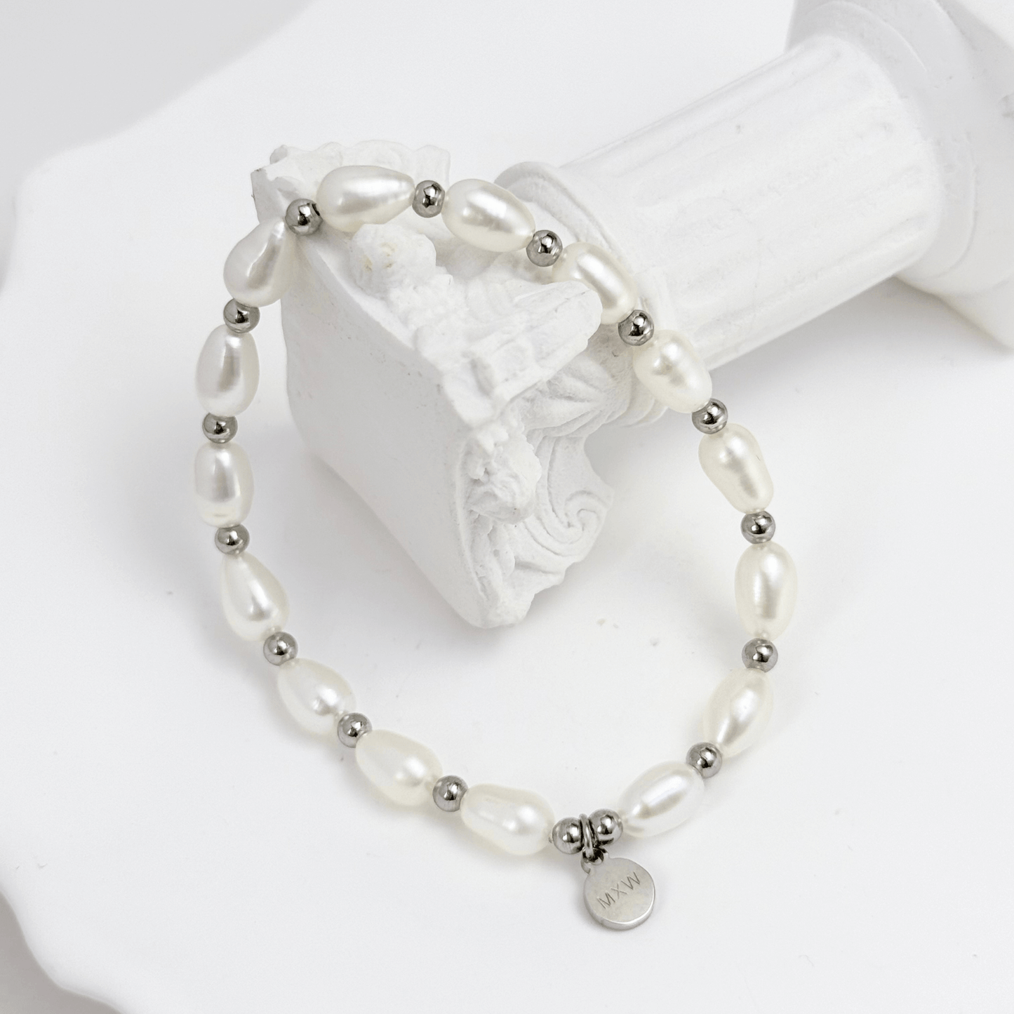 Pearl & Silver Bracelet with freshwater pearls and silver beads on stretch cord by MXW Jewellery