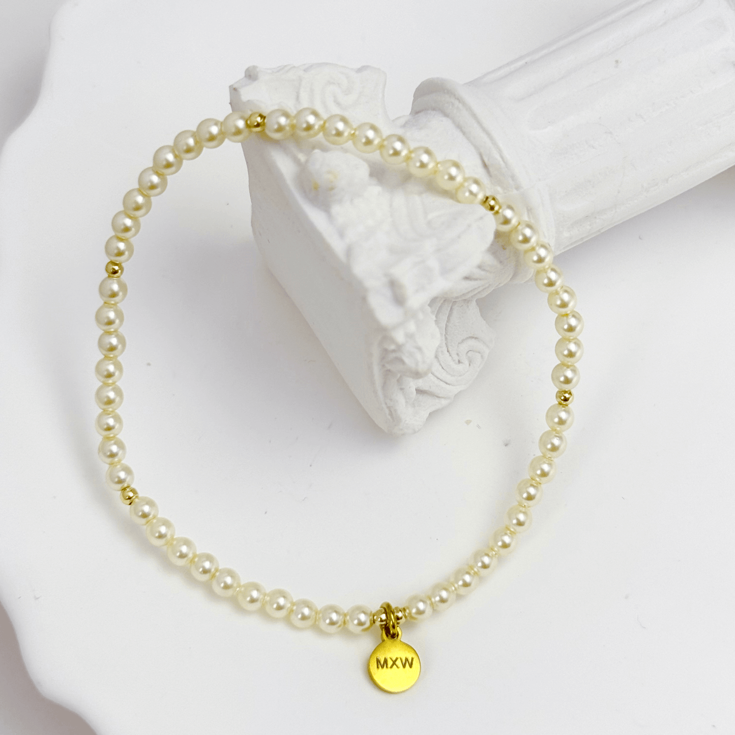Delicate gold bracelet with Swarovski crystal pearls and gold accents