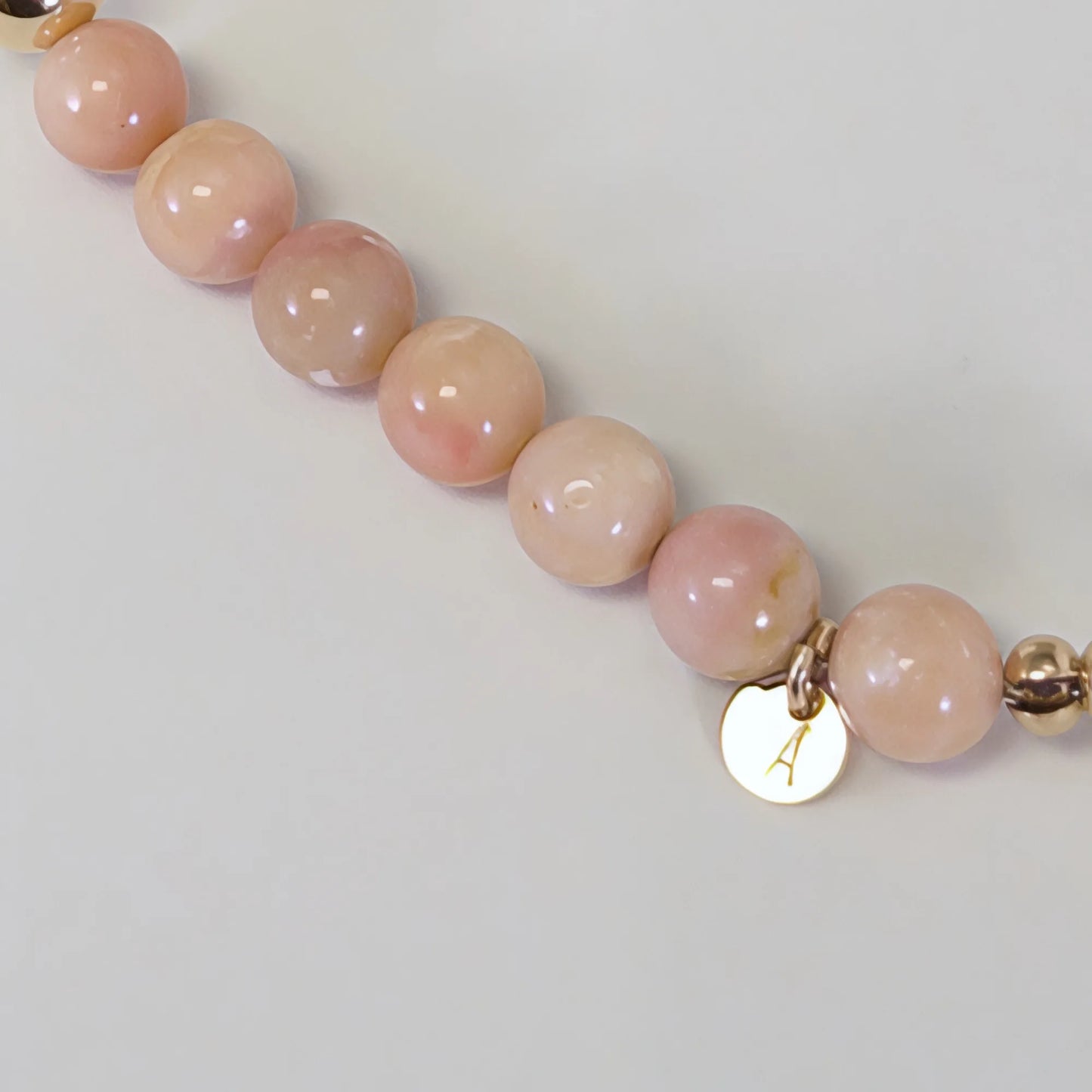 MXW Jewellery pink opal beaded bracelet with stamped initial disc and premium freshwater pearl.