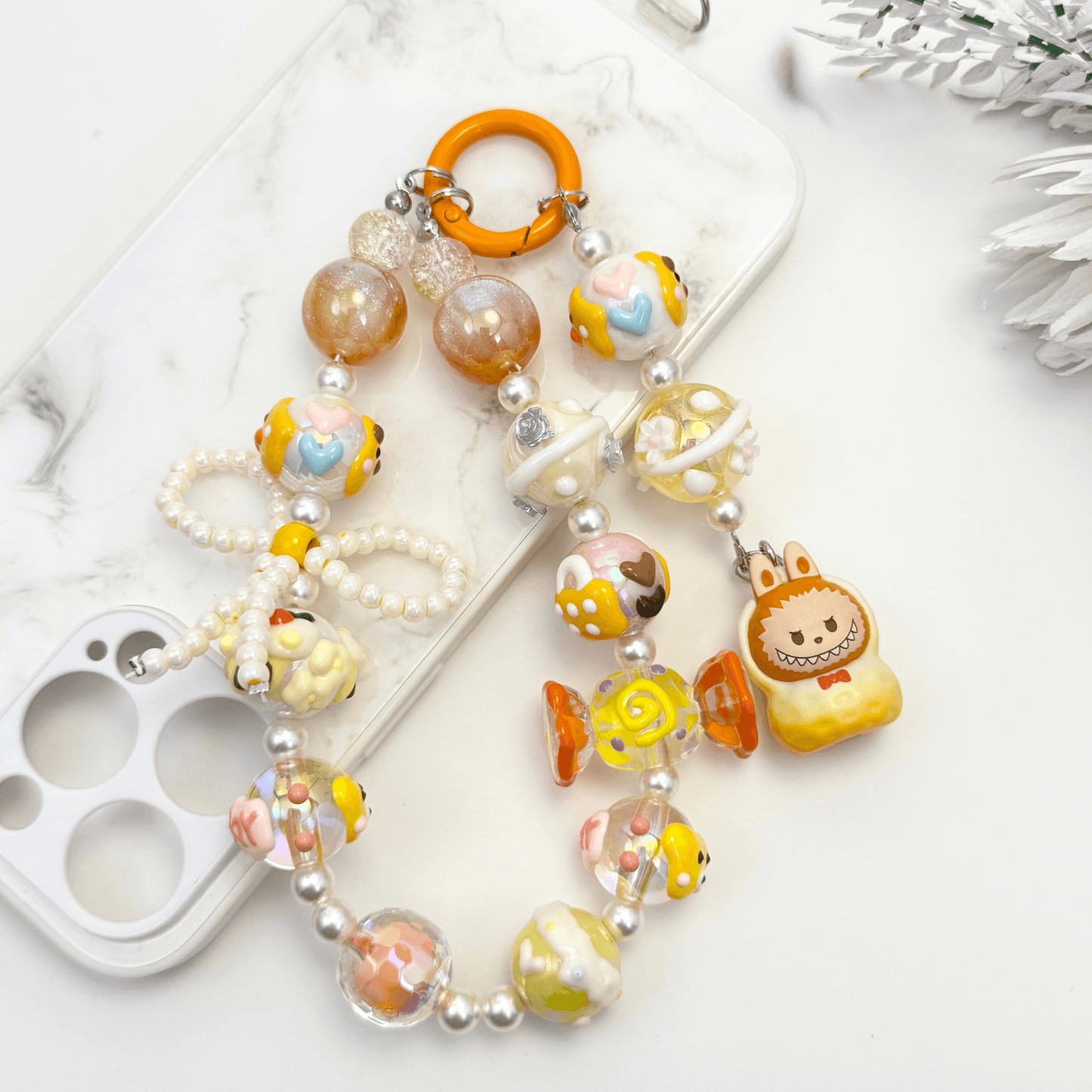 Handmade Labubu-inspired beaded keychains with pearls, glass beads, and colorful character charms – kawaii accessories in pastel and earth tones.
