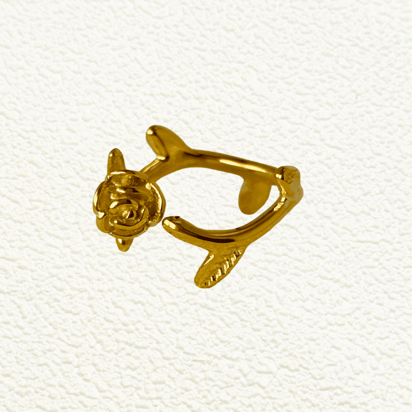 Gold sculpted rose vine ring in stainless steel with open adjustable design and leaf detail – romantic floral statement jewellery