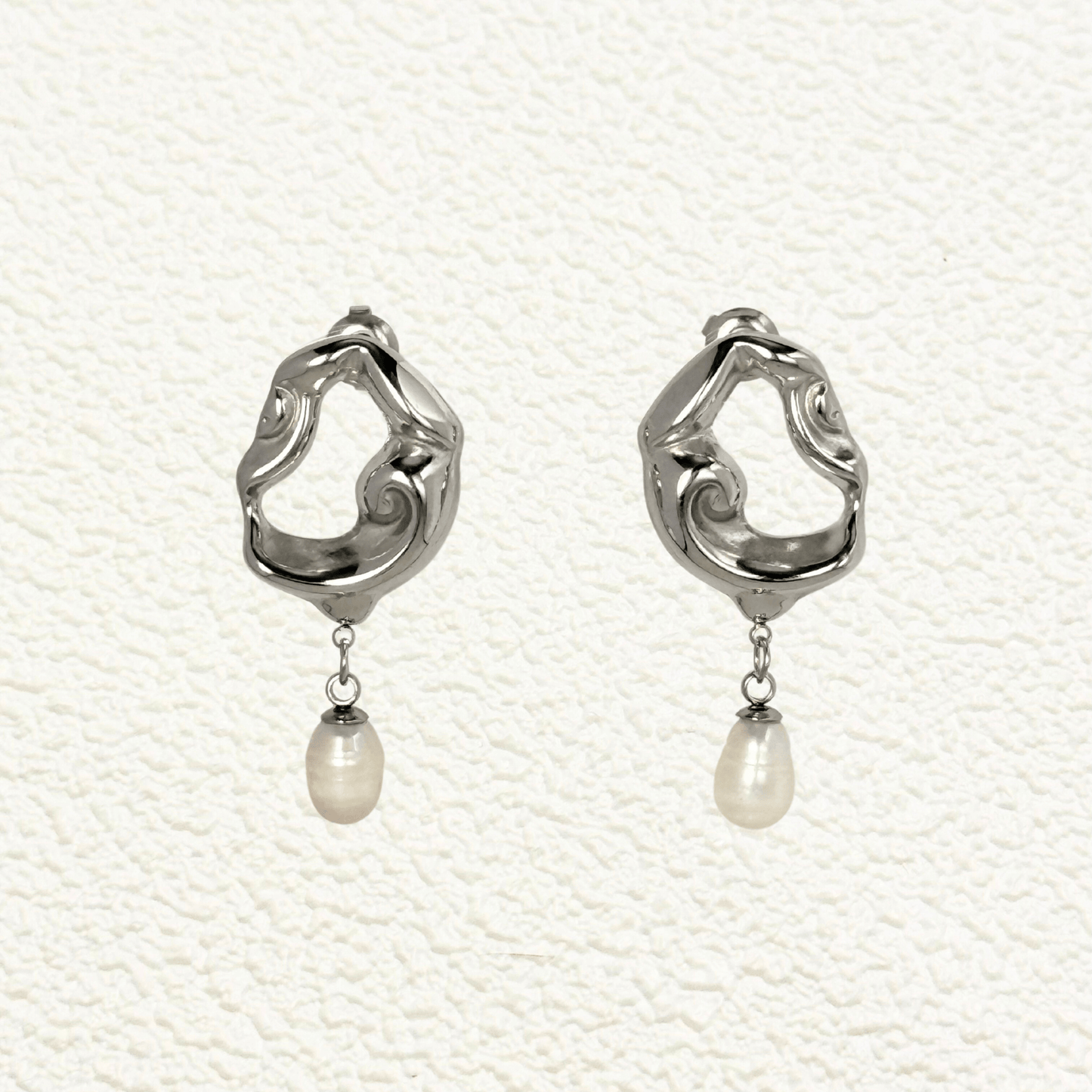 Sculpted gold and silver wave earrings with natural freshwater pearl drops – waterproof, tarnish-resistant minimalist jewellery by MXW Jewellery