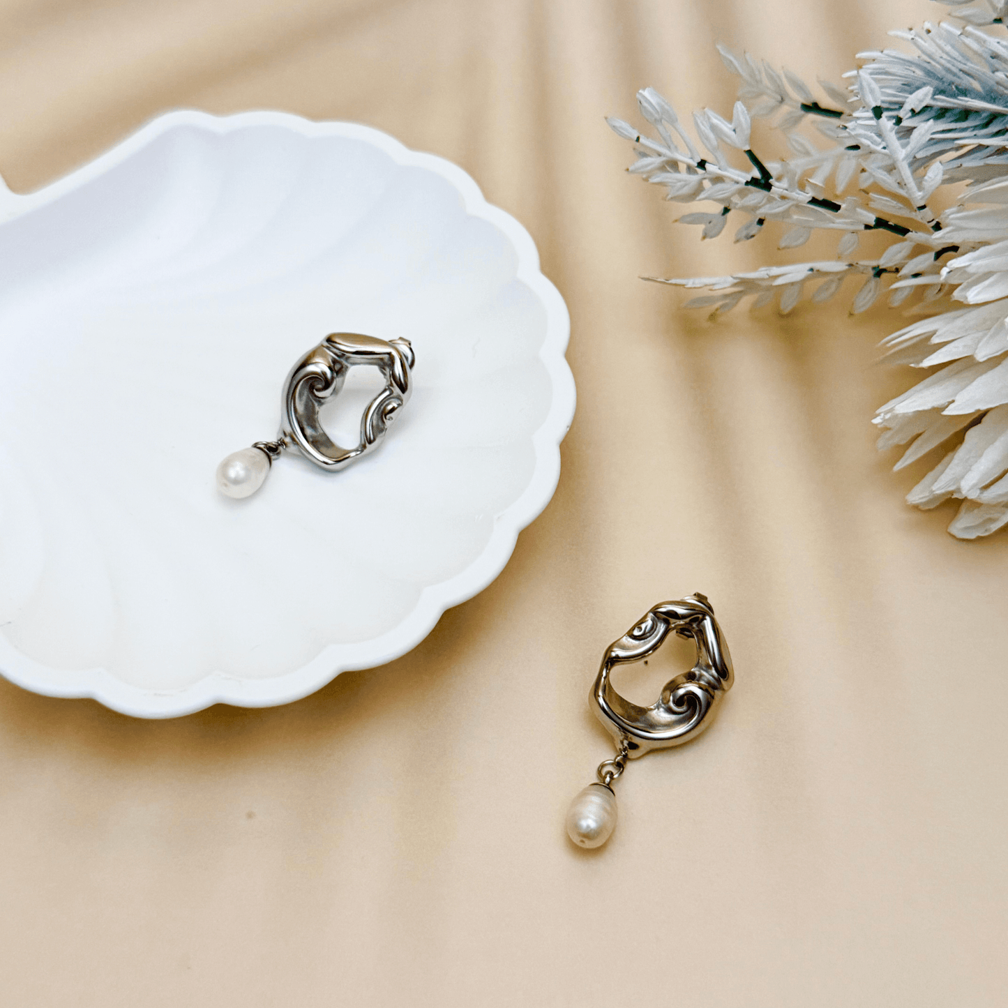 Sculpted gold and silver wave earrings with natural freshwater pearl drops – waterproof, tarnish-resistant minimalist jewellery by MXW Jewellery