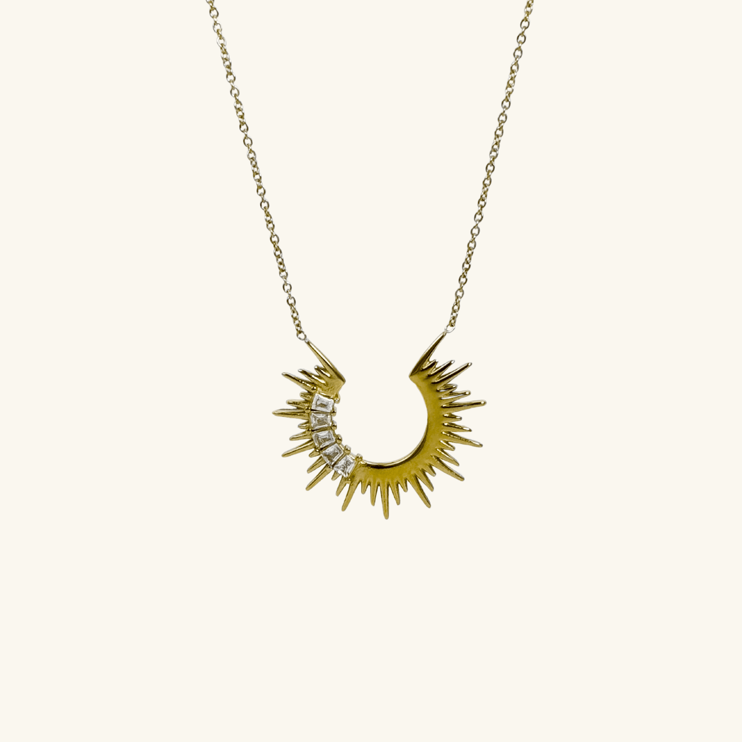 Waterproof sparkling sunburst necklace with a radiant crescent pendant in 18K PVD gold, accented with cubic zirconia