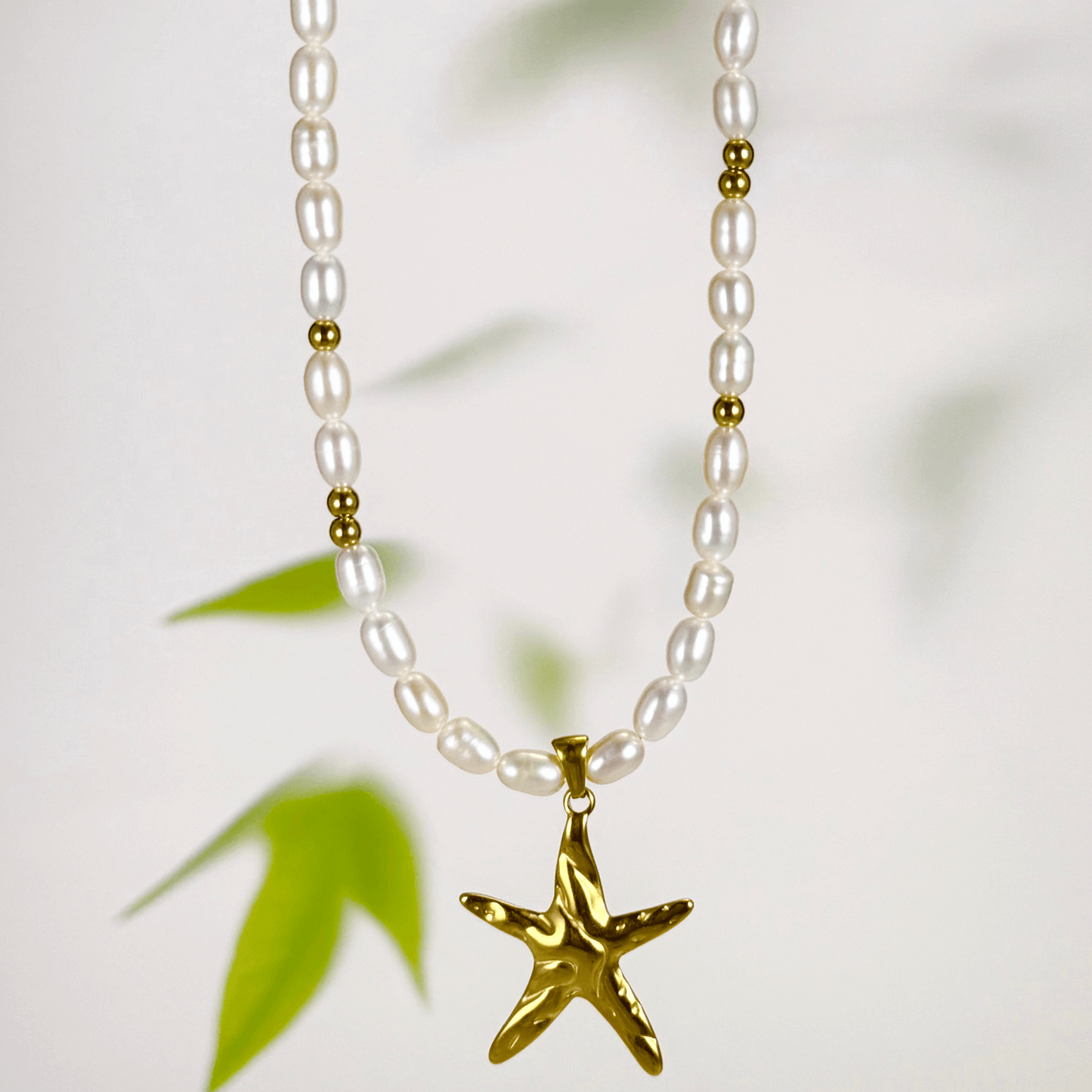 Gold starfish charm necklace with freshwater pearls – ocean-inspired jewellery