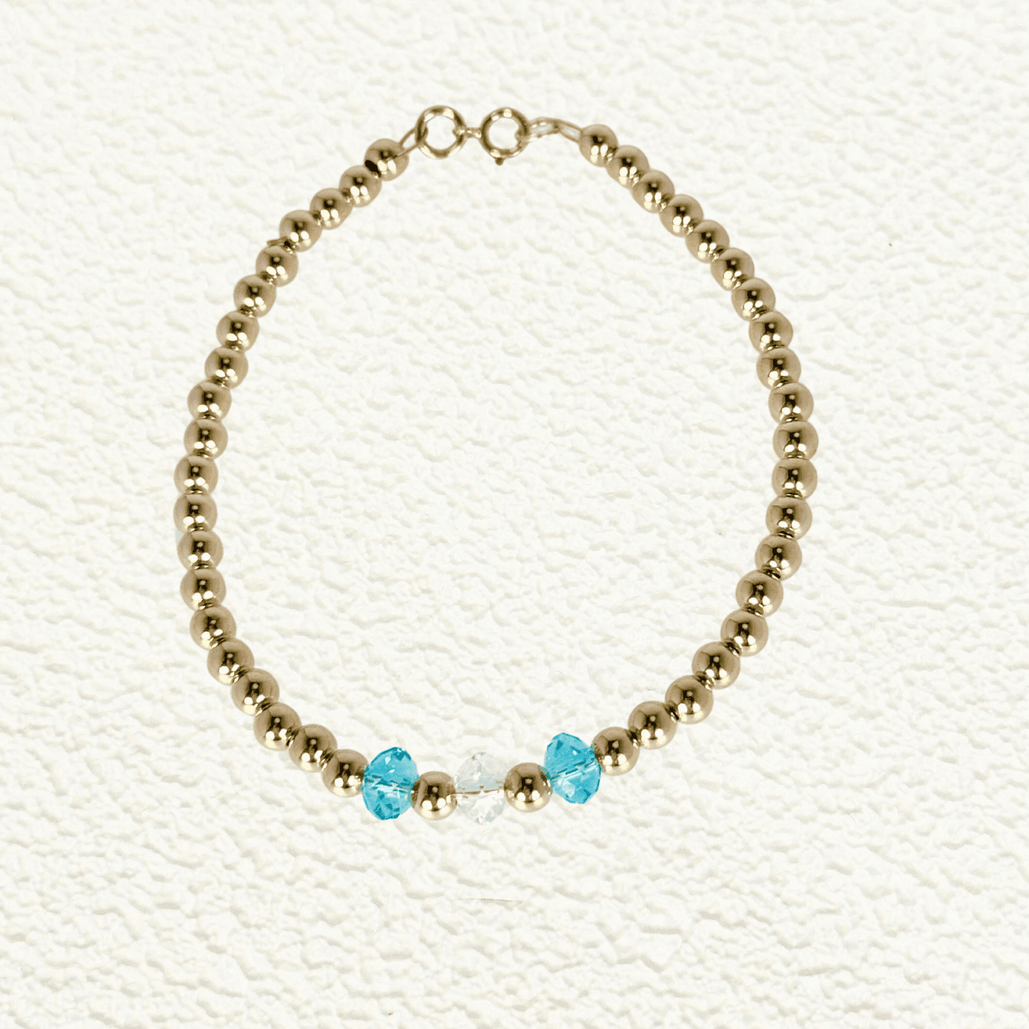 Personalised Swarovski birthstone beaded bracelet in gold-filled and sterling silver options, waterproof and customisable design by MXW Jewellery.