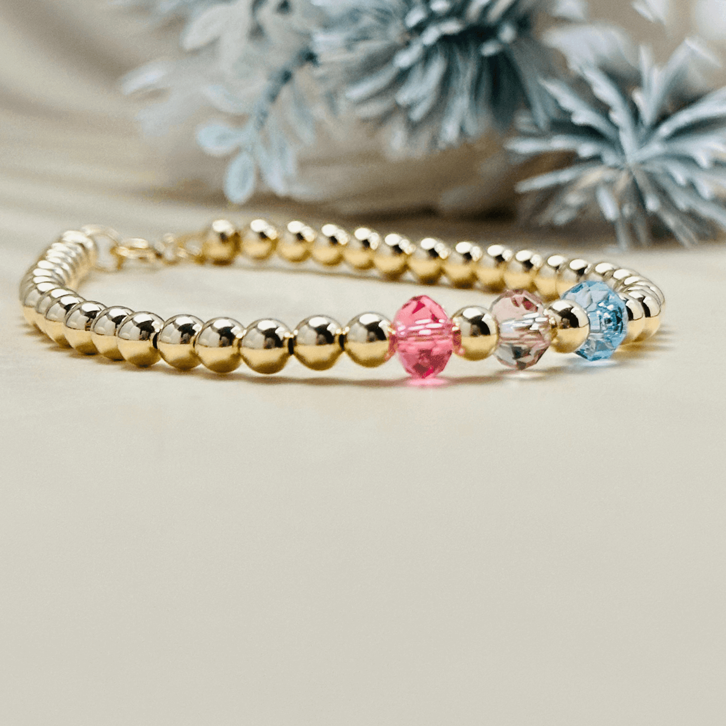 Personalised Swarovski birthstone beaded bracelet in gold-filled and sterling silver options, waterproof and customisable design by MXW Jewellery.