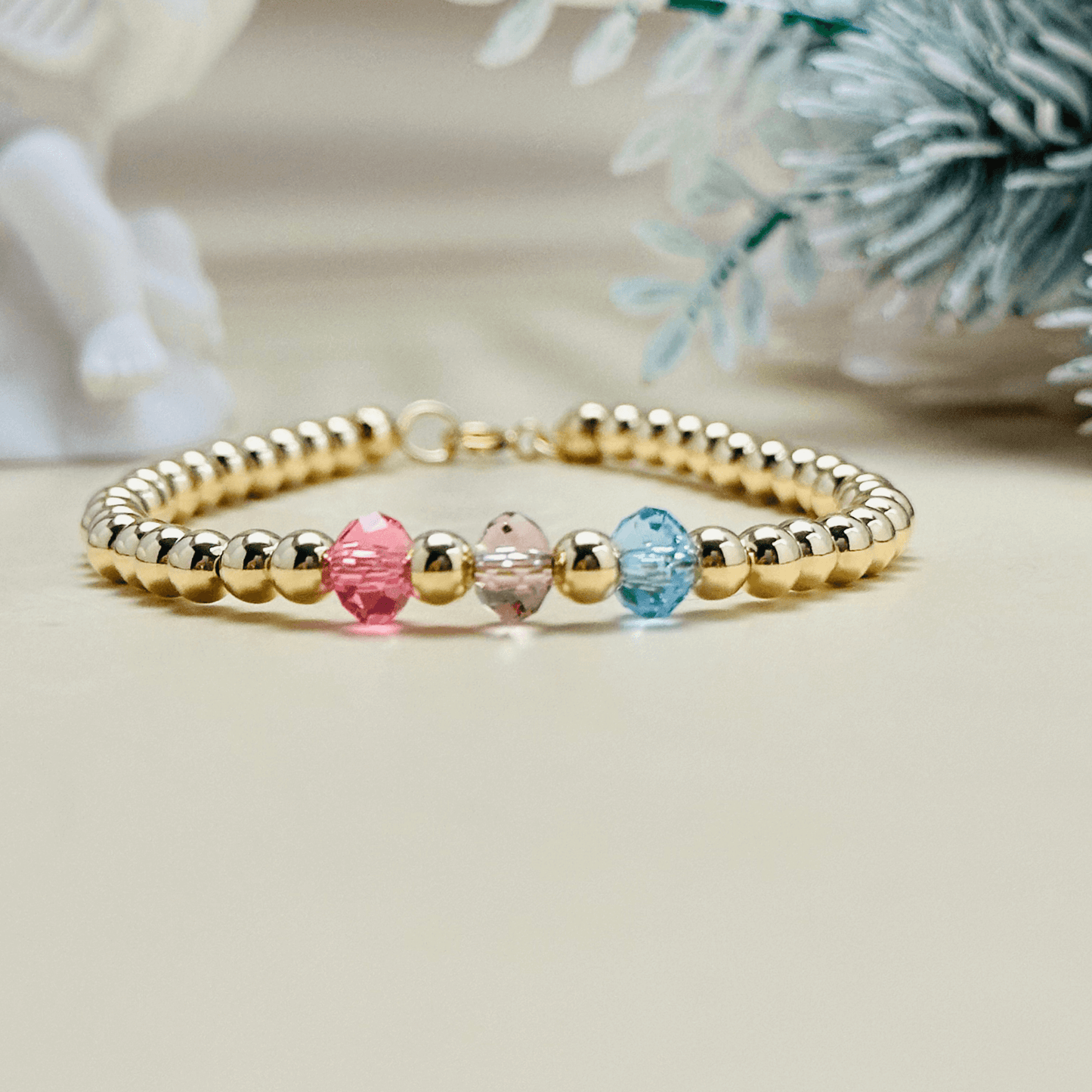 Personalised Swarovski birthstone beaded bracelet in gold-filled and sterling silver options, waterproof and customisable design by MXW Jewellery.