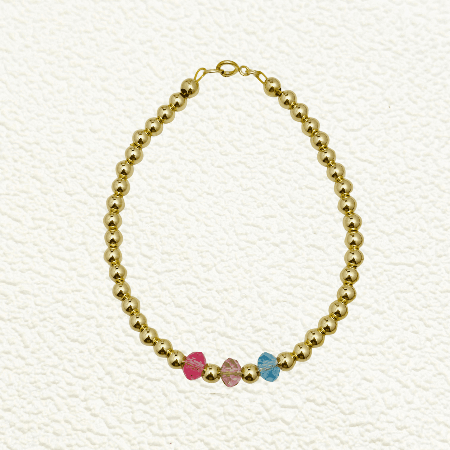Personalised Swarovski birthstone beaded bracelet in gold-filled and sterling silver options, waterproof and customisable design by MXW Jewellery.