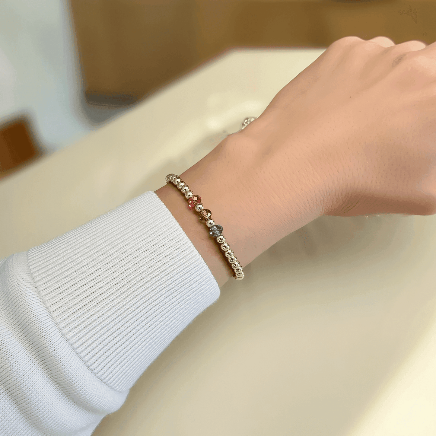 Personalised Swarovski birthstone beaded bracelet in gold-filled and sterling silver options, waterproof and customisable design by MXW Jewellery.