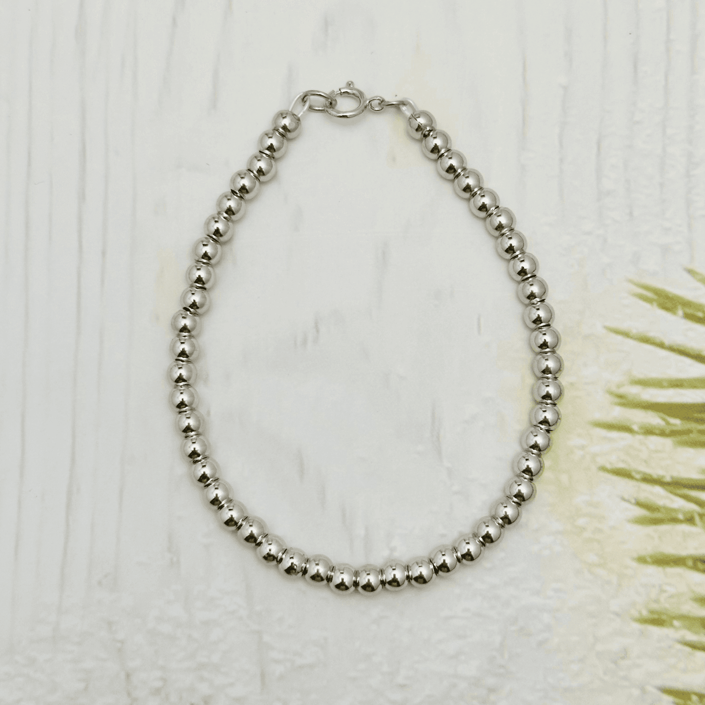 Personalised Swarovski birthstone beaded bracelet in gold-filled and sterling silver options, waterproof and customisable design by MXW Jewellery.
