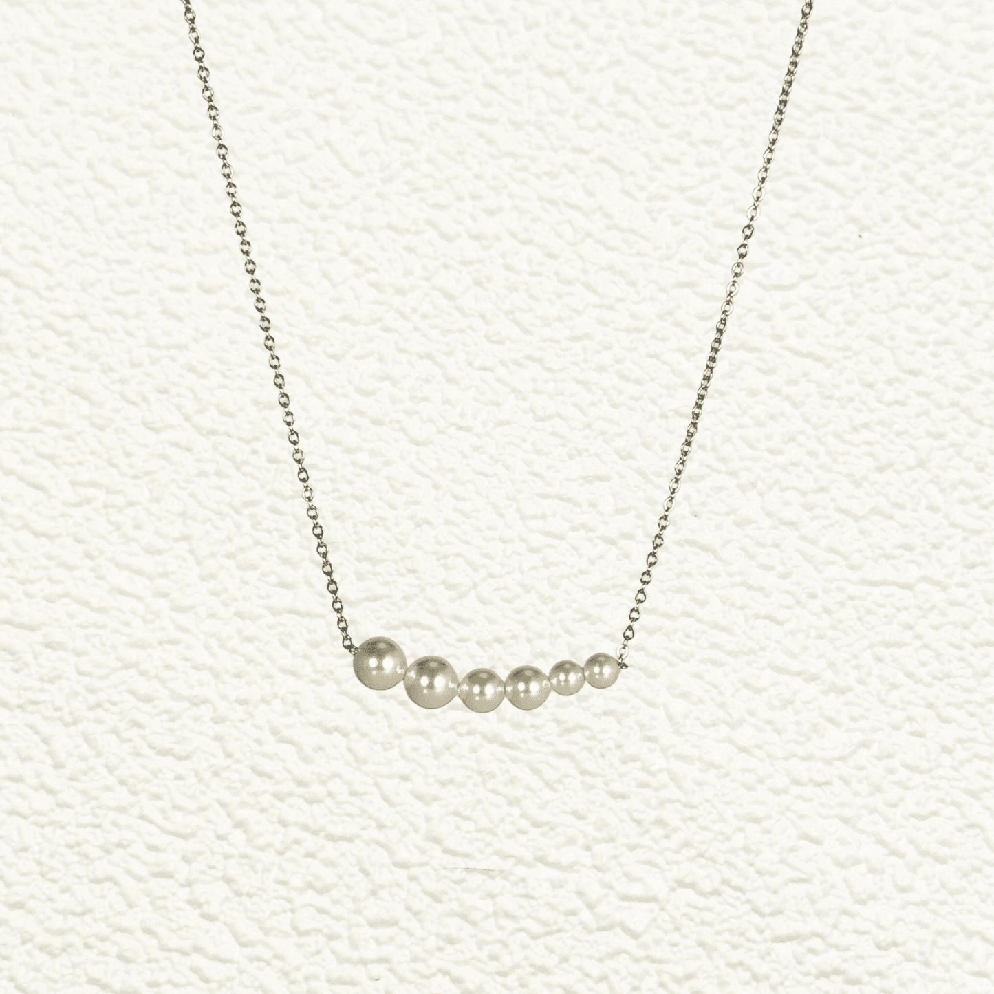 Tapered bar Swarovski crystal pearl necklace with gold and silver stainless steel chains, minimalist elegant design by MXW Jewellery.