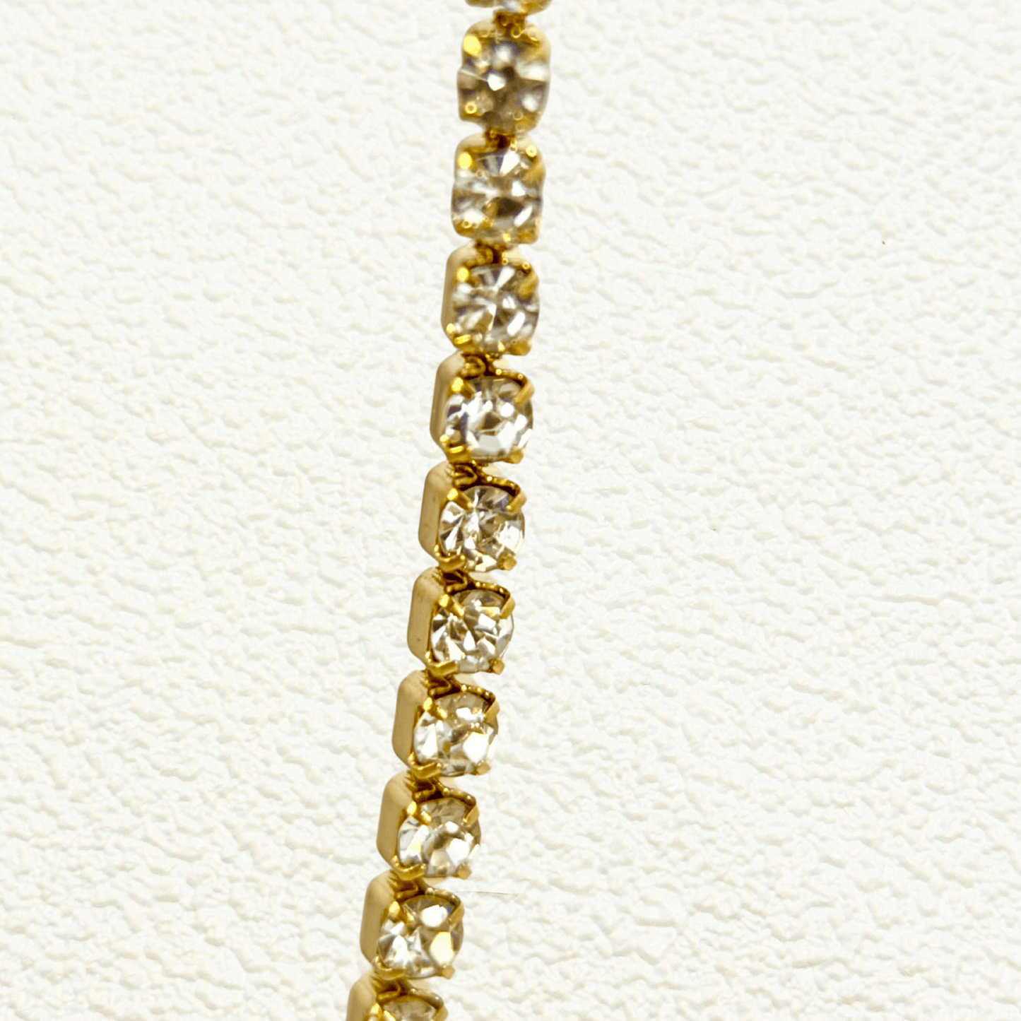 Tennis Zircon Gold Chain with cubic zirconia stones in gold prong setting on stainless steel chain