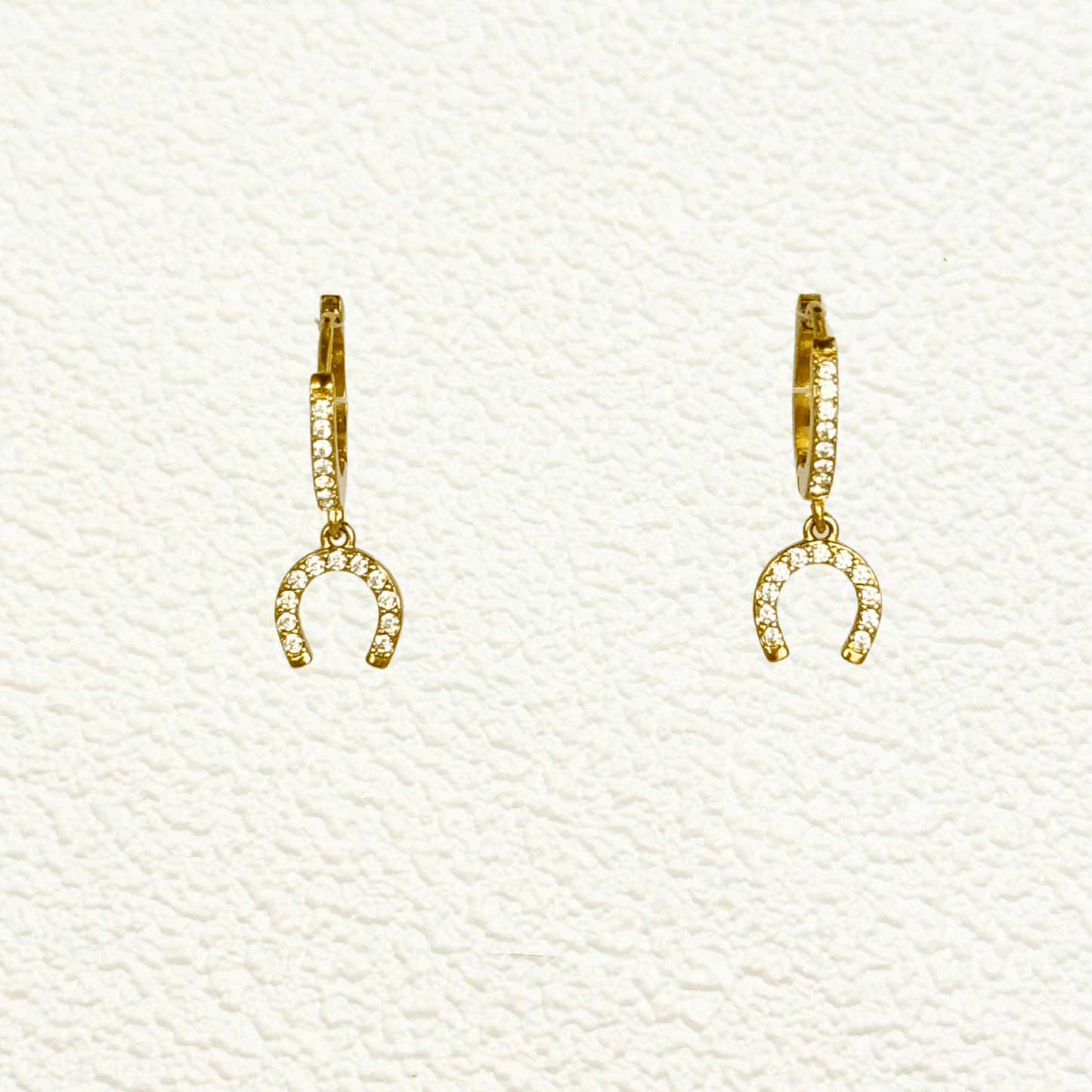 Tiny gold horseshoe charm huggie earrings with zircon stones, minimalist PVD gold plated stainless steel lucky charm hoops