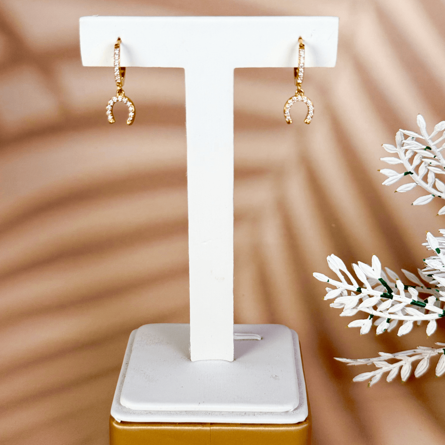 Tiny gold horseshoe charm huggie earrings with zircon stones, minimalist PVD gold plated stainless steel lucky charm hoops