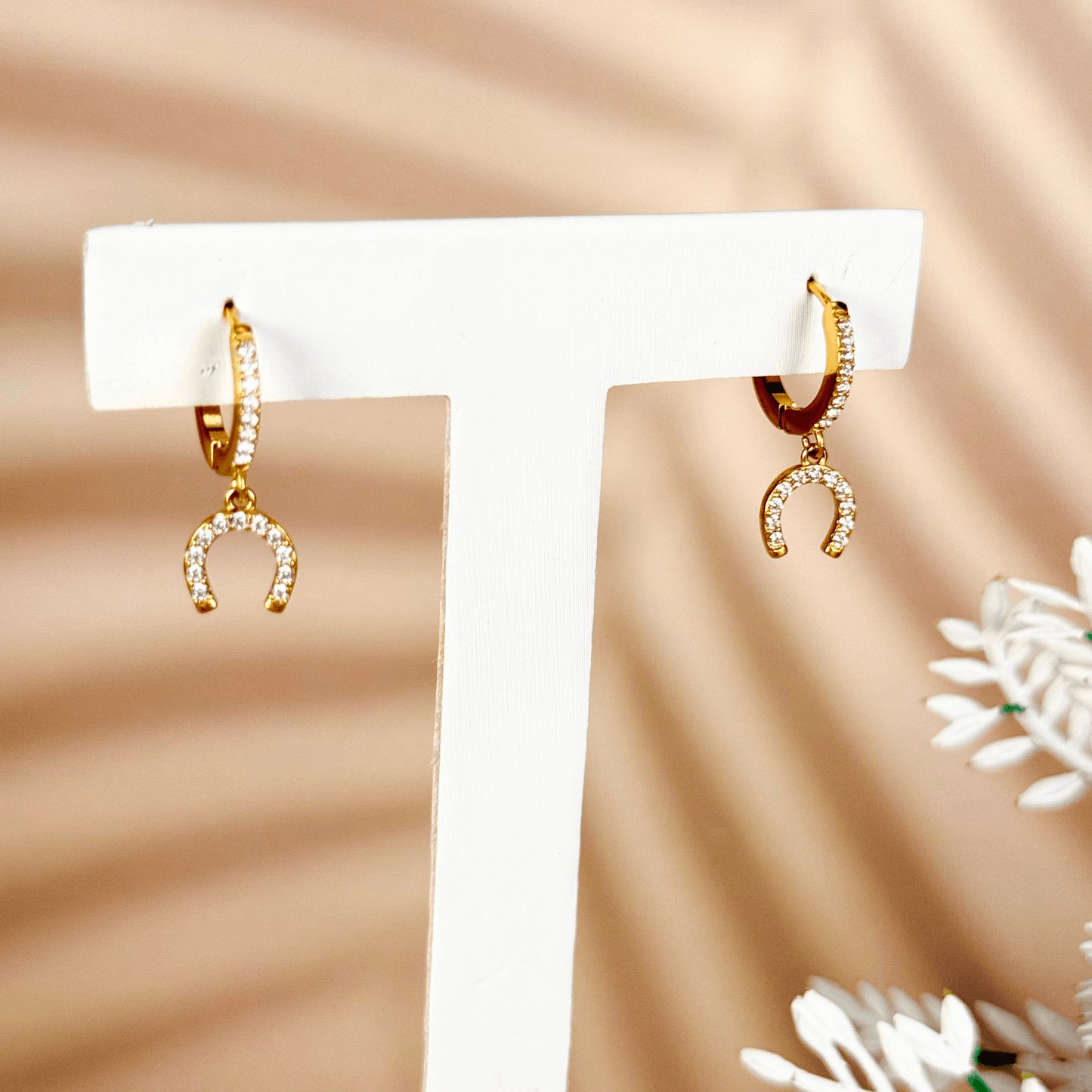 Tiny gold horseshoe charm huggie earrings with zircon stones, minimalist PVD gold plated stainless steel lucky charm hoops