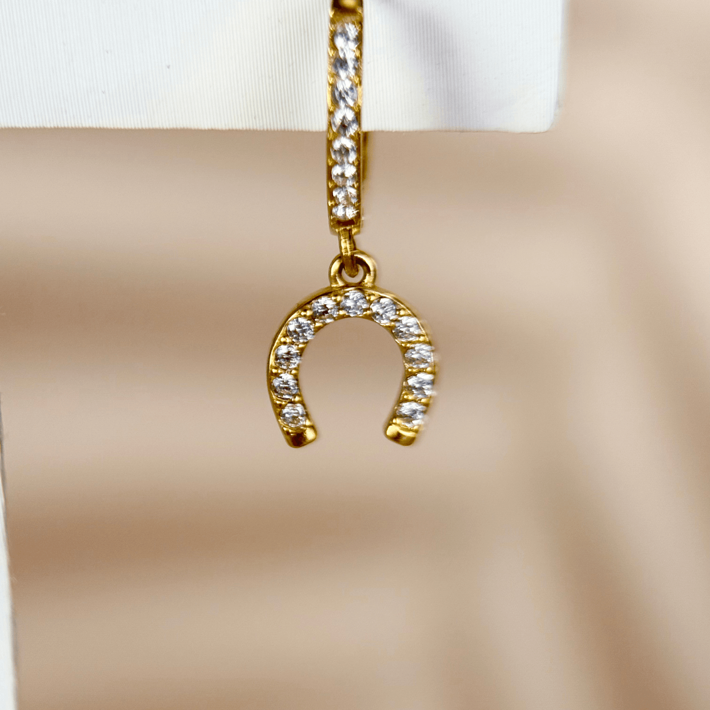 Tiny gold horseshoe charm huggie earrings with zircon stones, minimalist PVD gold plated stainless steel lucky charm hoops