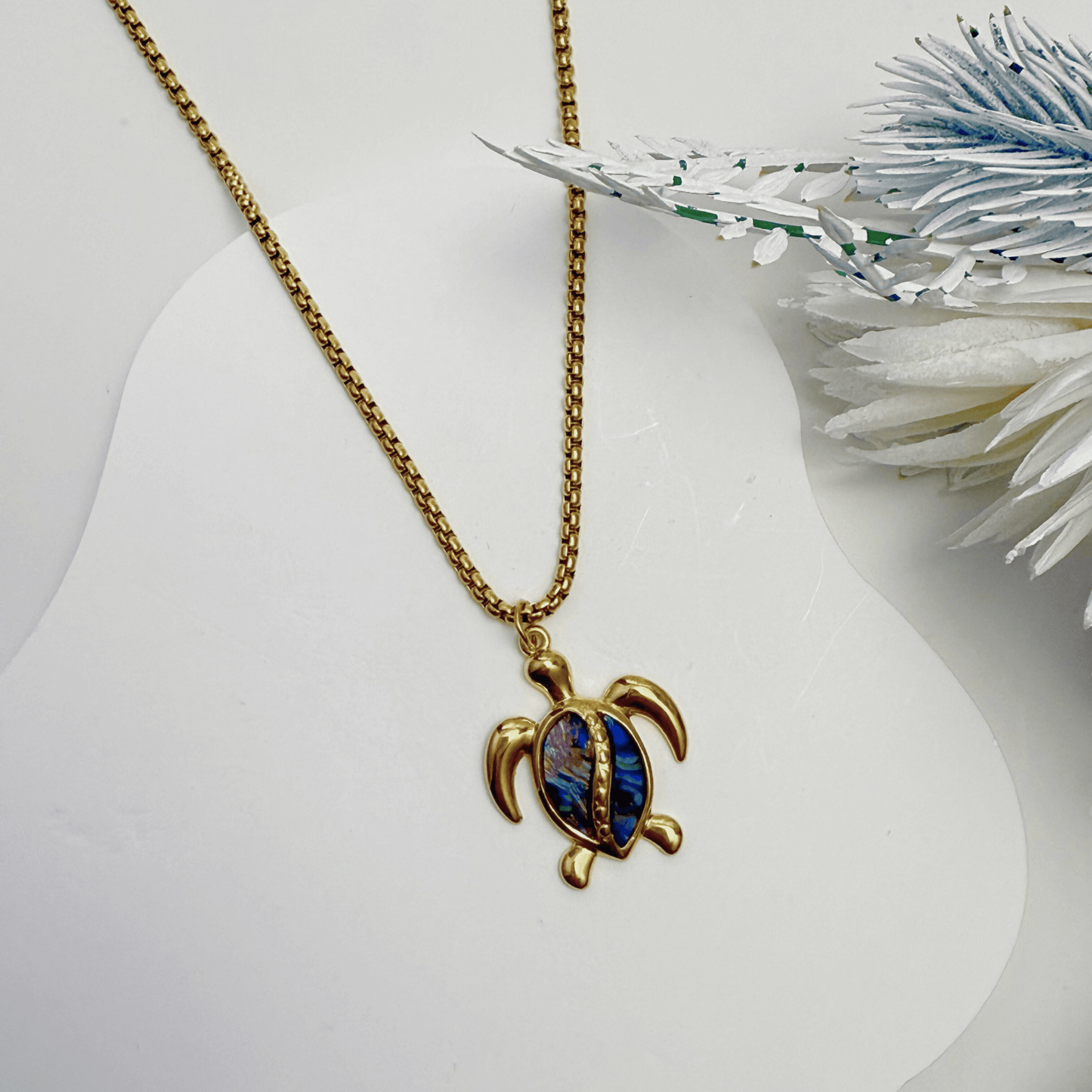 Waterproof gold turtle pendant necklace with abalone shell, shown on model with ocean-inspired details