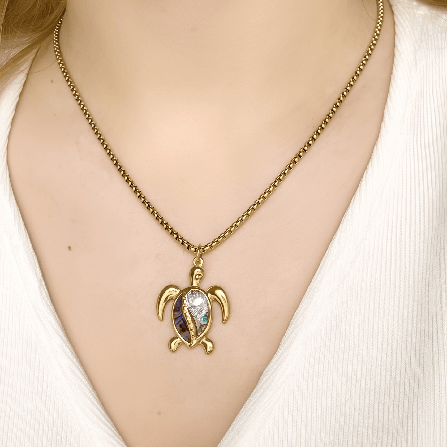 Waterproof gold turtle pendant necklace with abalone shell, shown on model with ocean-inspired details