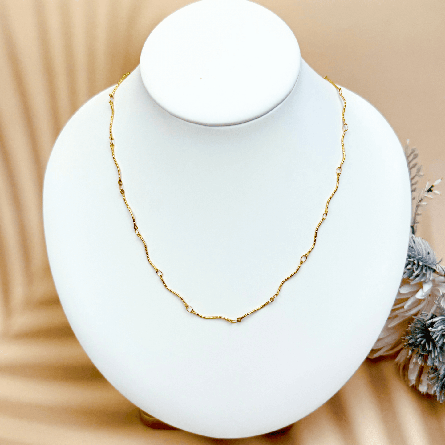 Wave Link Gold Chain made from waterproof gold PVD-plated stainless steel with textured wavy links