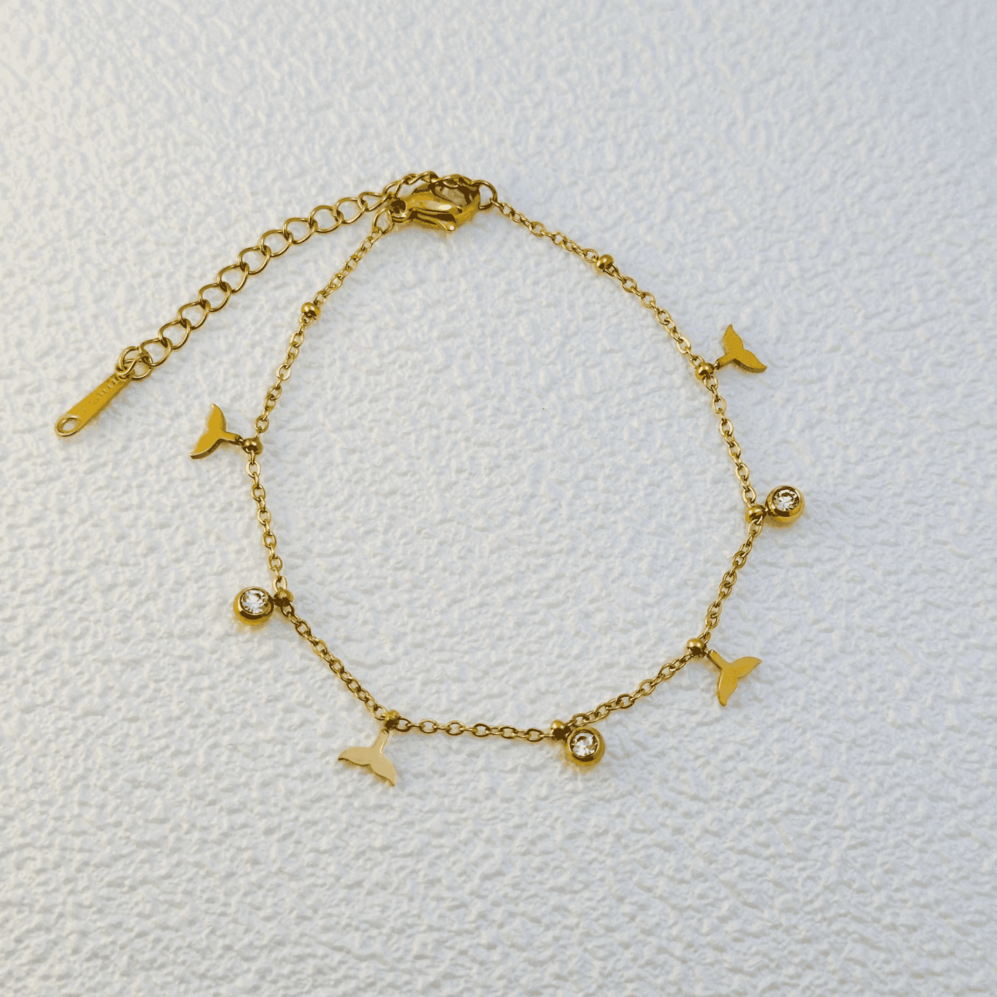 Gold whale tail charm bracelet with zircon stones, waterproof and tarnish-resistant.