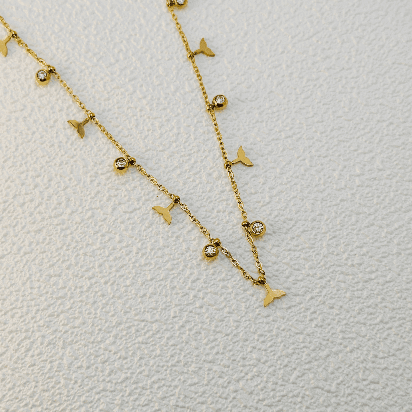 Gold whale tail charm necklace with zircon stones, waterproof and tarnish-resistant.