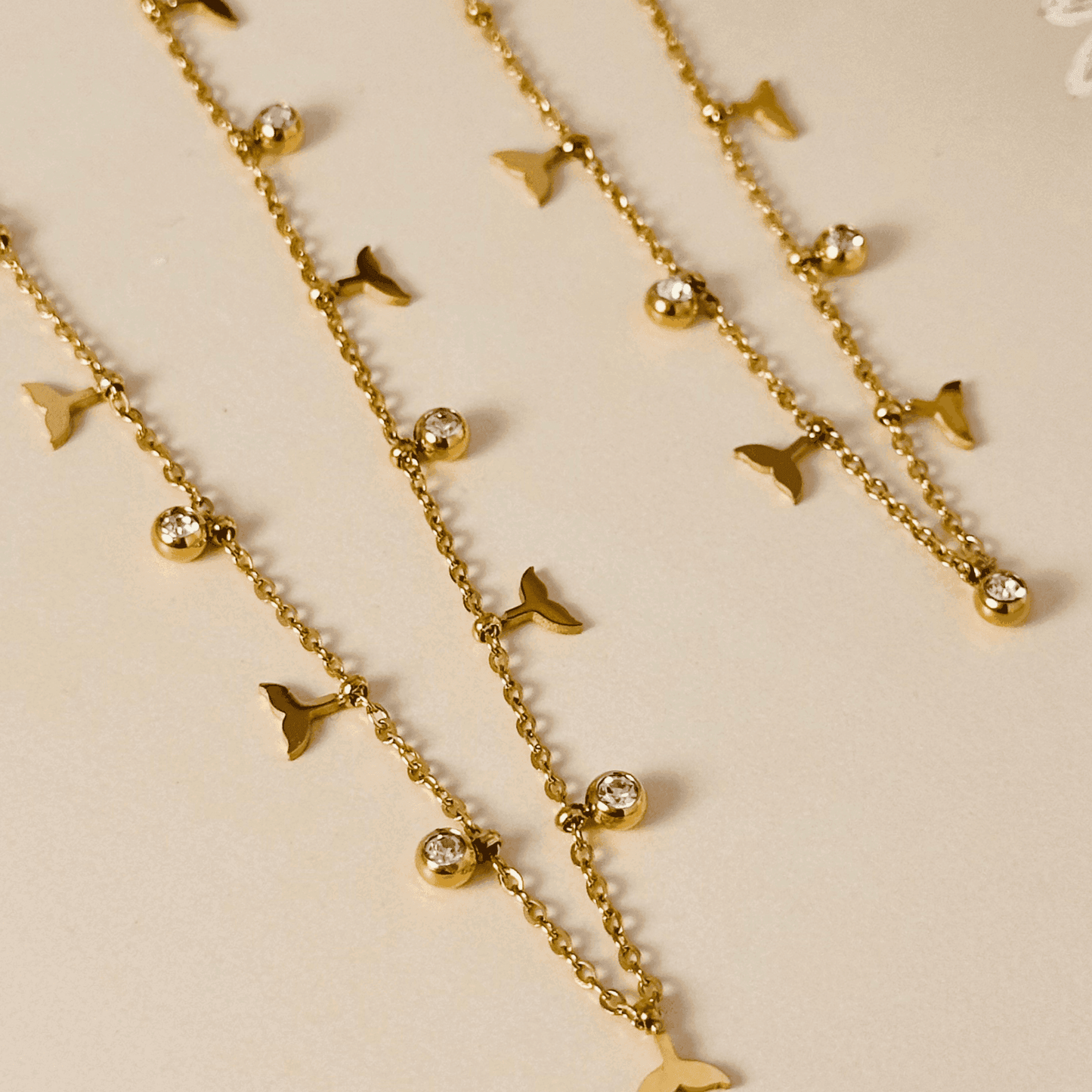 Gold whale tail charm necklace or bracelet with zircon stones, waterproof and tarnish-resistant.