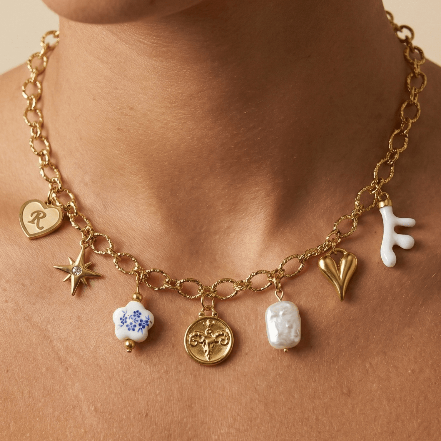 Pre-designed charm necklace layered with meaningful charms, handcrafted and waterproof for everyday style.