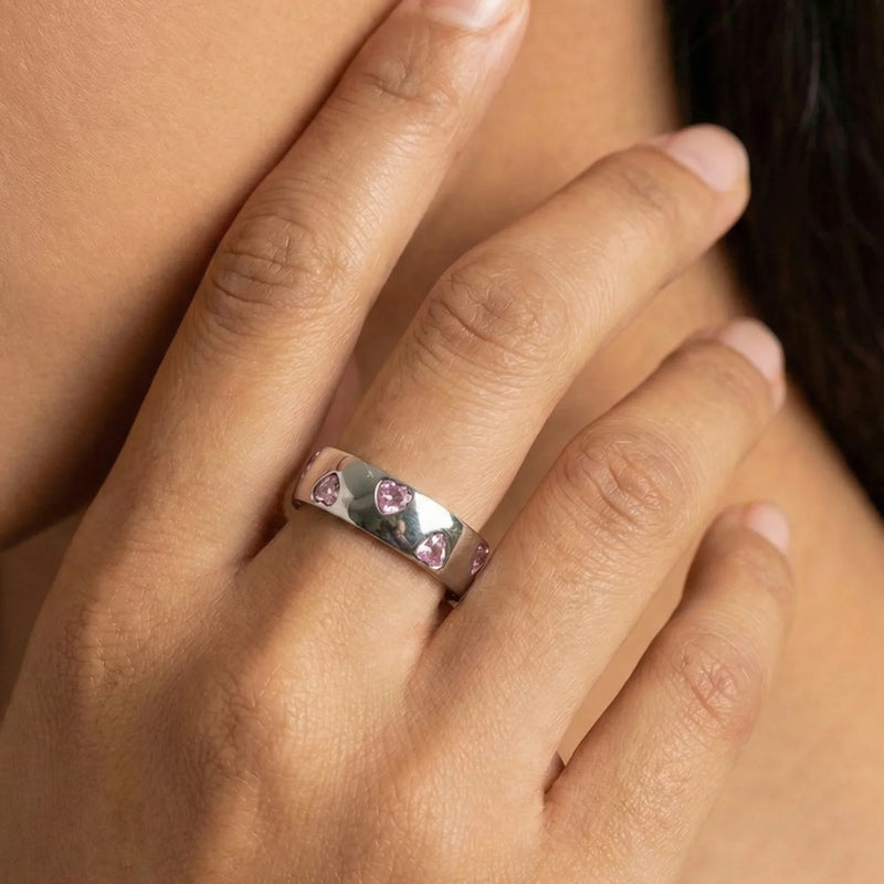 stylish gold rings from MXW Jewellery, including a bold flower design, organic texture band, and modern wave shape, perfect for a summer beach vibe.