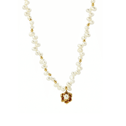 Elegant Camellia pearl necklace featuring natural baroque pearls and a sculpted gold bloom design