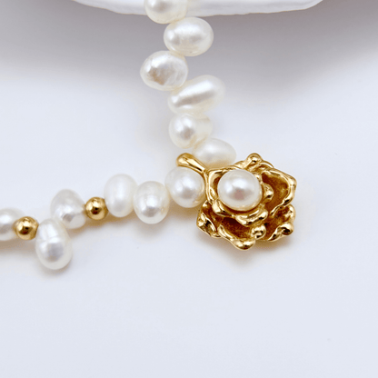 Elegant Camellia pearl necklace featuring natural baroque pearls and a sculpted gold bloom design