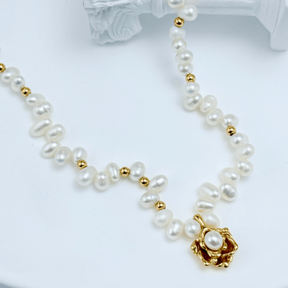 Elegant Camellia pearl necklace featuring natural baroque pearls and a sculpted gold bloom design